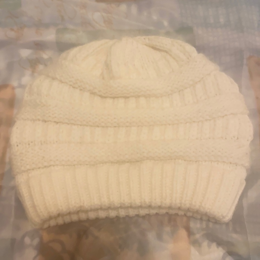 Woman’s knit hat. Light cream color. One size fits all.